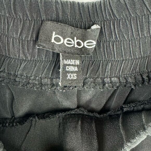 Bebe Y2K Strapless 100% silk strapless dress with waist tie and 4 front pockets. - Picture 3 of 5